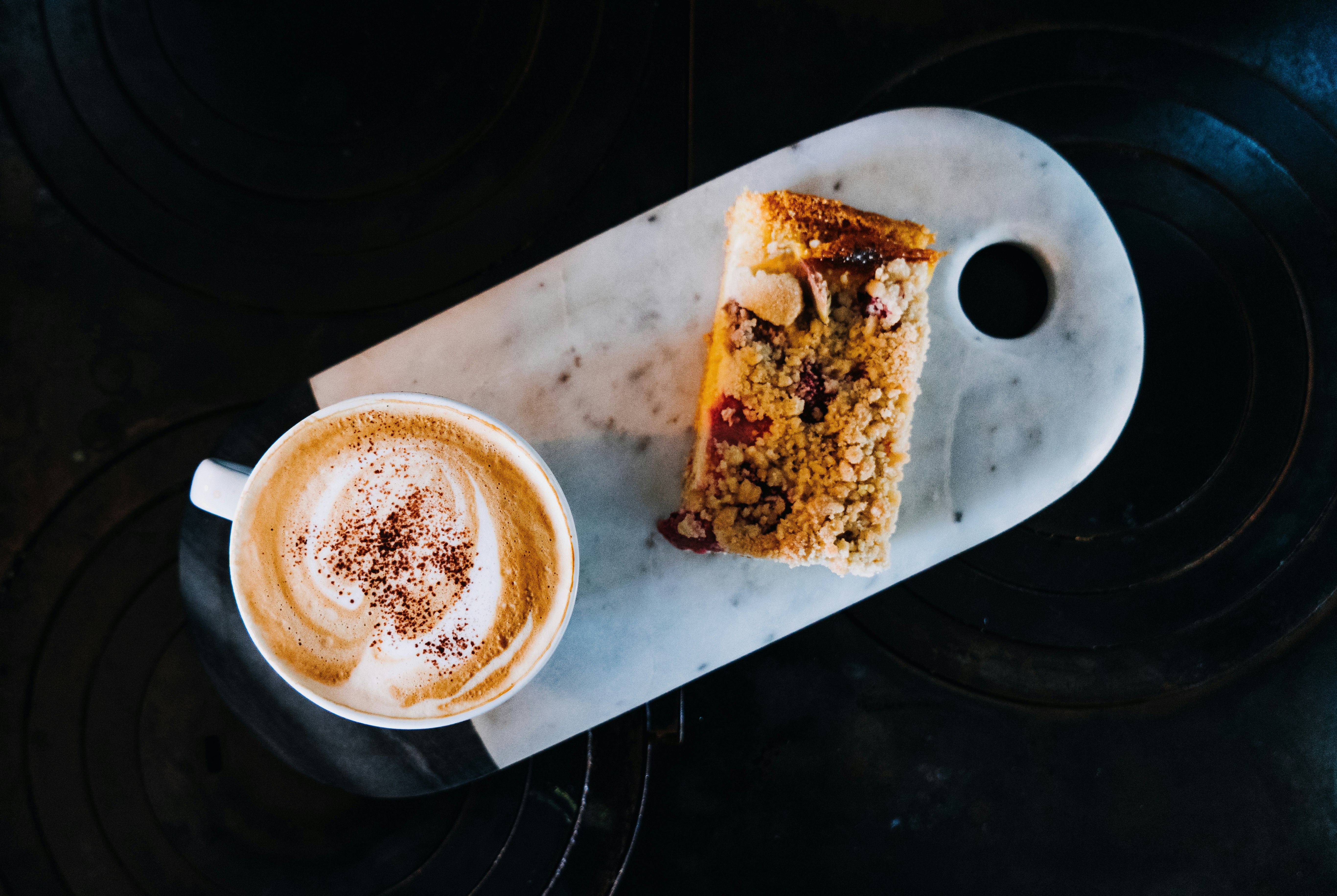 brown and white bread on white ceramic plate